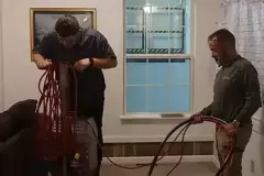 property restoration students removing water from the carpets